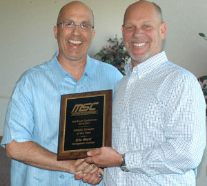 MSC Commissioner Steve Baker gives GC AD Eric Ward the Athletic Director of the Year Award as voted on by all MSC ADs.