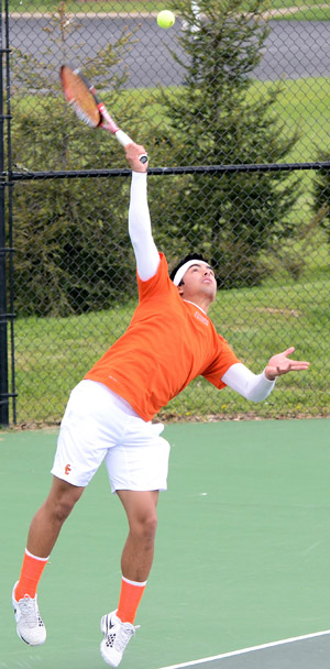 Benjamin Aspillaga serves during a tennis match earlier this year. Fans can help Tigers raise money clocking their serve.