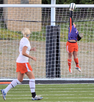 Kelsey Givens leaps for a save against Mount Vernon to keep the game tied at 1-1. Photo by Richard Davis